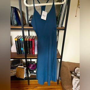 Halara teal midi workout dress. High thigh slit detail built in bra and shorts.